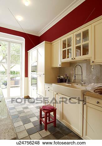 Stock Photo - Kitchen with tiled floor. Fotosearch
