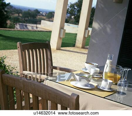 Picture - Laid breakfast table on terrace. Fotosearch