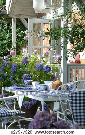 Laid breakfast table on terrace View Large Photo Image Stock Image - Laid breakfast table on terrace. Fotosearch