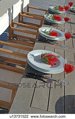 Stock Image - Laid table outdoors. Fotosearch