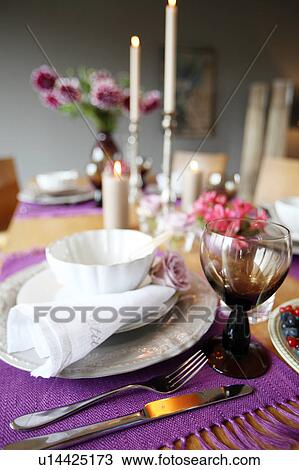 Laid table with flowers and candles View Large Photo Image Stock Image - Laid table with flowers and candles. Fotosearch