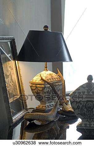 Lamp and antlers on dresser View Large Photo Image Stock Photo - Lamp and antlers on dresser. Fotosearch