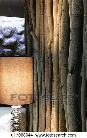 Picture - Lamp and logs in a row. Fotosearch