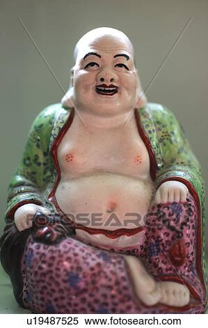 Stock Photography - Laughing mans figurine. Fotosearch