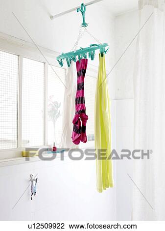 Stock Image - Laundry hanging in bathroom. Fotosearch