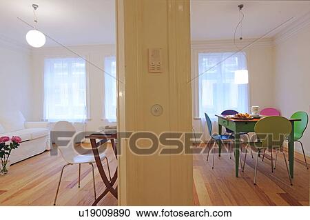 Stock Image - Living room and dining room in an apartment. Fotosearch