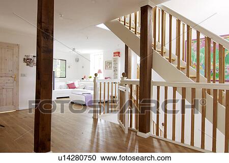 Stock Image - Living room on upper floor of a house. Fotosearch