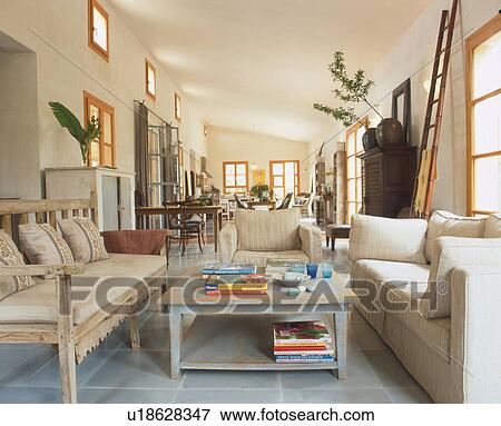Stock Photo - Living room with couch and bench. Fotosearch