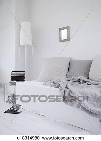 Living room with couch, radio and floor lamp View Large Photo Image Stock Image - Living room with couch, radio and floor lamp. Fotosearch