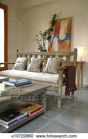 Stock Image - Living room with table and bench. Fotosearch