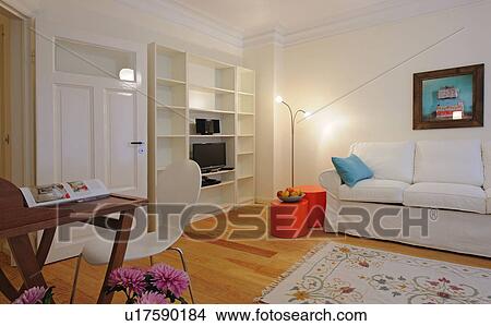 Living room with wooden floor and bunch of flowers View Large Photo Image Picture - Living room with wooden floor and bunch of flowers. Fotosearch