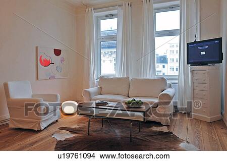 Living room with wooden floor and fur View Large Photo Image Picture - Living room with wooden floor and fur. Fotosearch