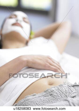 Lying woman with face mask View Large Photo Image Stock Image - Lying woman with face mask. Fotosearch