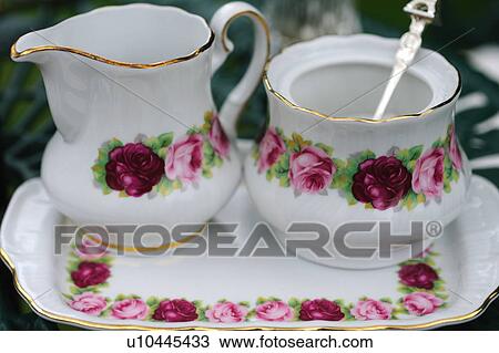 Milk and sugar in floral receptacles View Large Photo Image Stock Image - Milk and sugar in floral receptacles. Fotosearch