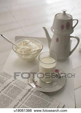 Milk glass, jug, newspaper and bowl with curd View Large Photo Image Stock Photo - Milk glass, jug, newspaper and bowl with curd. Fotosearch