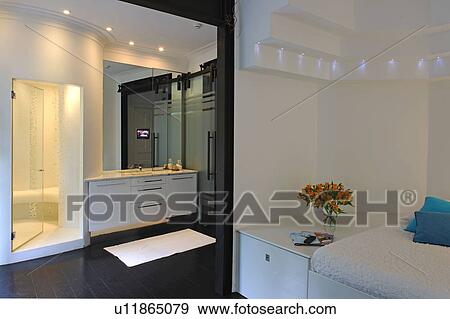 Modern bathroom with passage to bedroom View Large Photo Image Stock Photo - Modern bathroom with passage to bedroom. Fotosearch