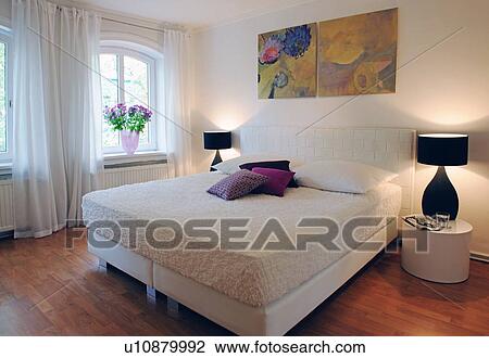 Modern bedroom with paintings above the bed View Large Photo Image Stock Image - Modern bedroom with paintings above the bed. Fotosearch