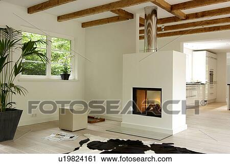 Stock Image - Modern bright living room with fireplace. Fotosearch