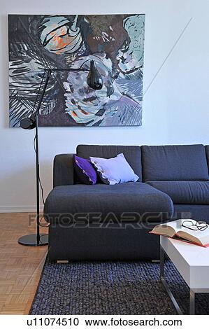 Stock Image - Modern living room with painting. Fotosearch