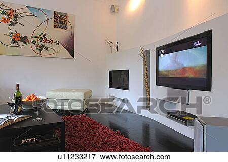 Modern living room with widescreen TV View Large Photo Image Stock Photo - Modern living room with widescreen TV. Fotosearch