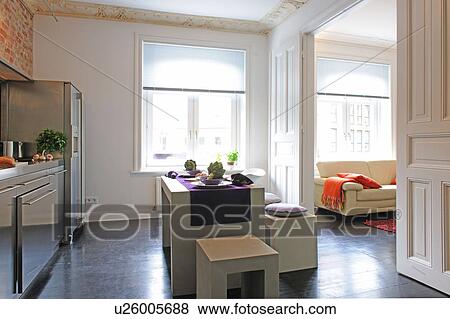 Stock Photo - Modern open plan kitchen with passage to living room. Fotosearch