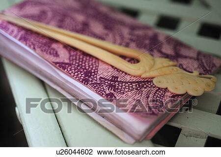 Stock Image - Napkins and napkin holder. Fotosearch