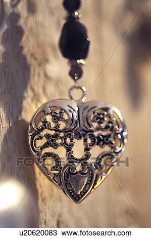 Stock Image - Necklace with heart-shaped pendant. Fotosearch
