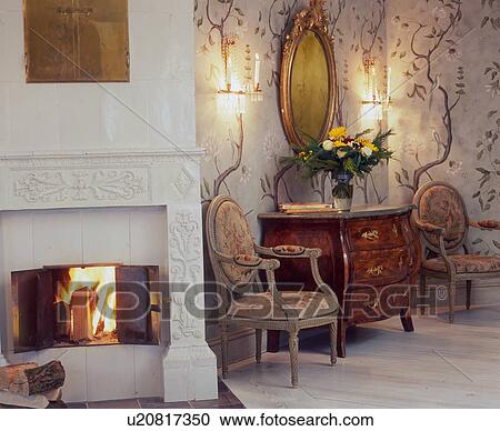 Old chairs and dresser at the fireplace View Large Photo Image Stock Image - Old chairs and dresser at the fireplace. Fotosearch