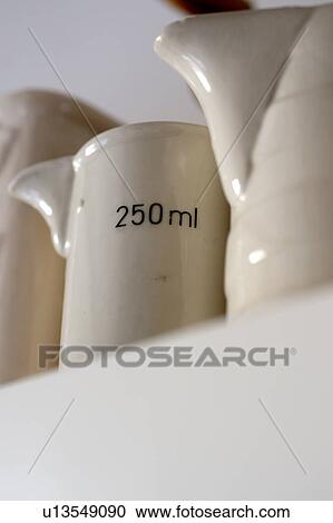 Old-fashioned measuring jug on ledge View Large Photo Image Stock Image - Old-fashioned measuring jug on ledge. Fotosearch