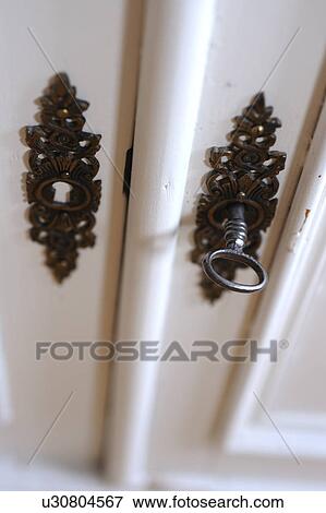 Stock Photo - Old-fashioned wardrobe key. Fotosearch