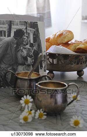 Stock Photo - Old photograph, blossoms, bread and jugs. Fotosearch