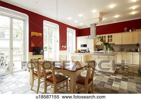 Open plan kitchen with dining area and tiled floor View Large Photo Image Stock Photography - Open plan kitchen with dining area and tiled floor. Fotosearch