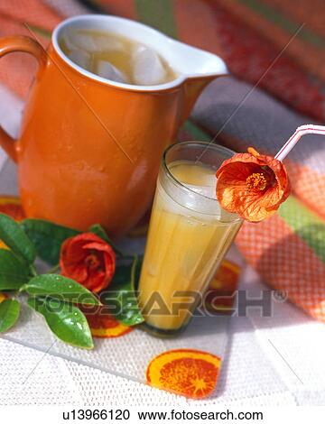 Stock Image - Orange juice with mallow flowers. Fotosearch