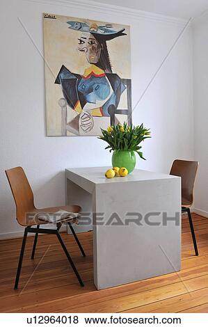 Stock Photo - Painting above table with bunch of flowers. Fotosearch