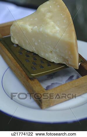 Parmesan on cheese grater View Large Photo Image Stock Image - Parmesan on cheese grater. Fotosearch