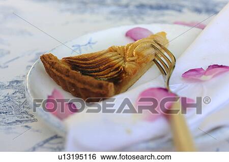 Piece of apple pie on plate with rose petals View Large Photo Image Stock Photograph - Piece of apple pie on plate with rose petals. Fotosearch