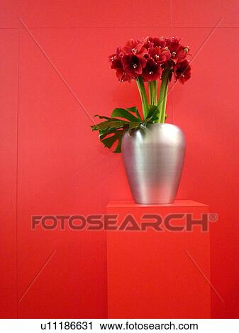 Red bunch of flowers in silver vase View Large Photo Image Stock Image - Red bunch of flowers in silver vase. Fotosearch