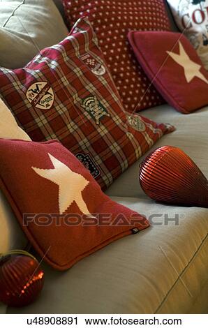 Red cushions and Christmas baubles on couch View Large Photo Image Stock Image - Red cushions and Christmas baubles on couch. Fotosearch