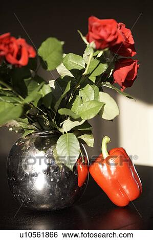 Red pepper and bunch of roses View Large Photo Image Stock Photograph - Red pepper and bunch of roses. Fotosearch