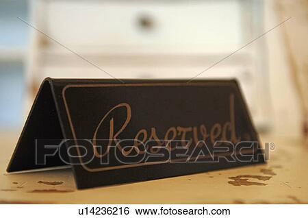 Reserved sign on table View Large Photo Image Stock Photograph - Reserved sign on table. Fotosearch