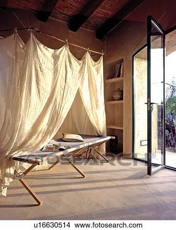 Picture - Room with open terrace door. Fotosearch