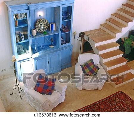 Room with two armchairs and blue cabinet View Large Photo Image Stock Image - Room with two armchairs and blue cabinet. Fotosearch