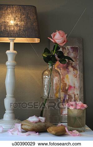 Rose and table lamp on dresser View Large Photo Image Stock Photo - Rose and table lamp on dresser. Fotosearch