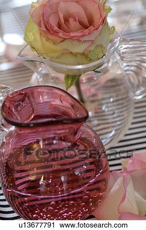 Rose blossom in glass vase View Large Photo Image Stock Image - Rose blossom in glass vase. Fotosearch