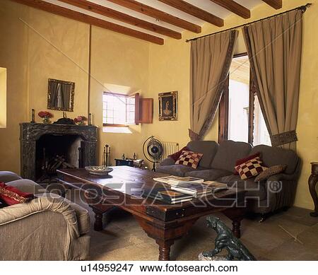 Stock Photo - Rustic living room with fireplace. Fotosearch