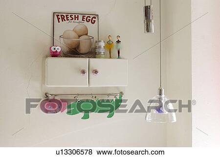Shelf in kitchen with animal figurines View Large Photo Image Stock Photo - Shelf in kitchen with animal figurines. Fotosearch