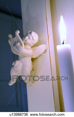 Small Putto and burning candle View Large Photo Image Stock Photograph - Small Putto and burning candle. Fotosearch