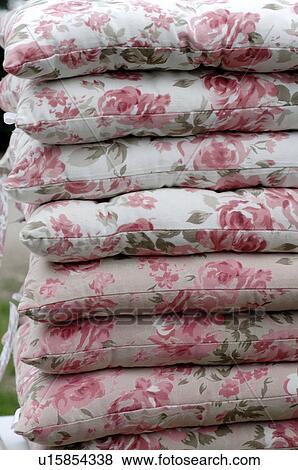 Stack of chair cushions with floral pattern View Large Photo Image Stock Photo - Stack of chair cushions with floral pattern. Fotosearch