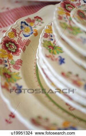 Picture - Stack of plates with floral pattern. Fotosearch