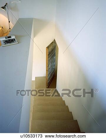 Stairs and door in a house View Large Photo Image Stock Image - Stairs and door in a house. Fotosearch